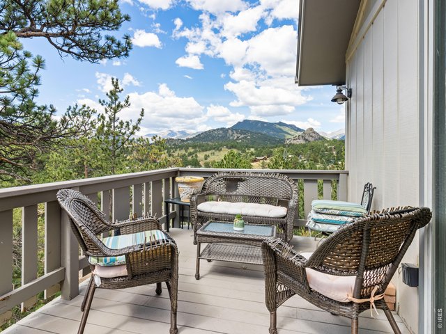 Property Photo 20 Unit 3: Private deck has mountain views