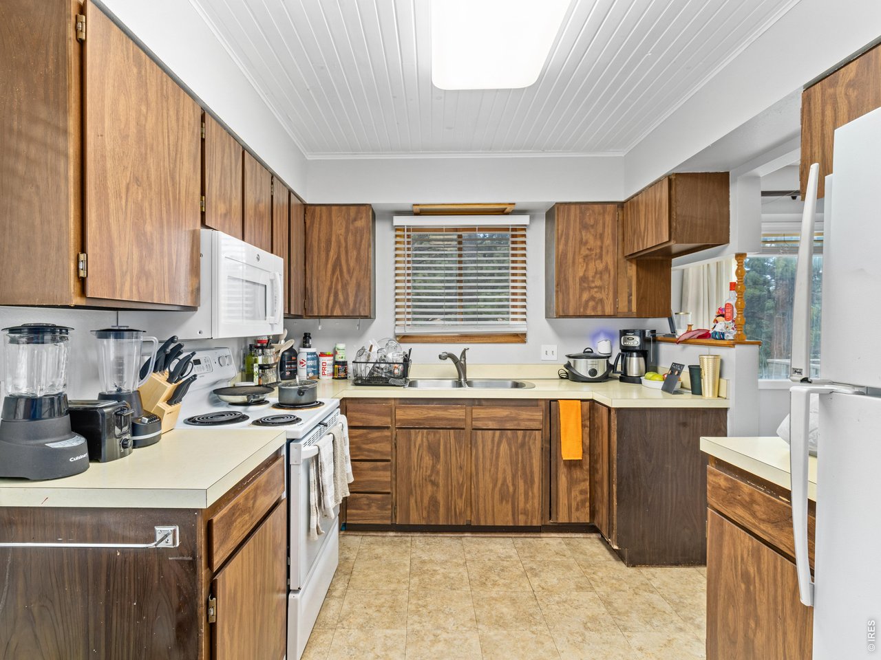 Property Photo 21 Unit 3: Laundry closet just off of the kitchen