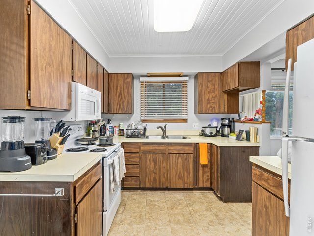 Property Photo 21 Unit 3: Laundry closet just off of the kitchen
