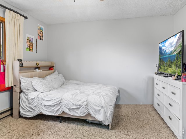 Property Photo 24 Unit 3: Bedroom 1 of 2