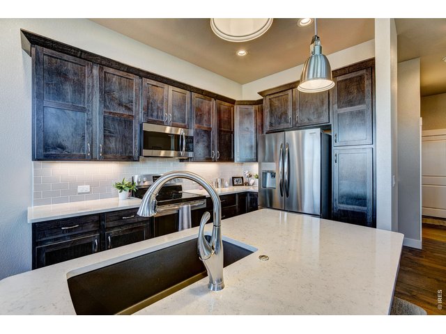 Property Photo 16 Electric range, built-in microwave, and refrigerator included.