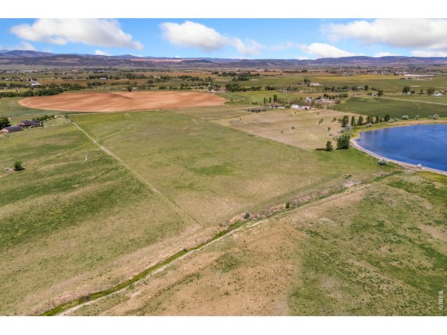 Property Photo 6 The property features expansive, unobstructed views of the Front Range and surrounding foothills, with gently rolling, highly usable terrain and established agricultural ground that has historically supported solid hay production.