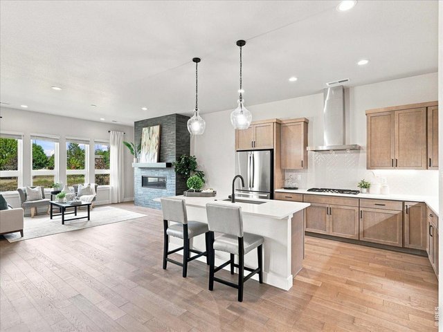 Property Photo 8 Beautiful engineered hardwood flooring flows through the main living areas.