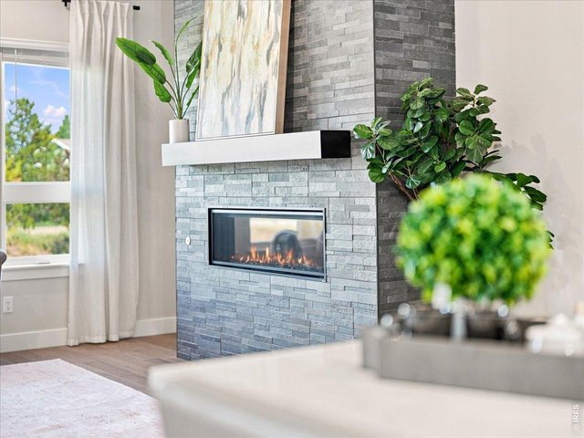 Property Photo 14 Custom fireplace mantle adds character and style to the living space.