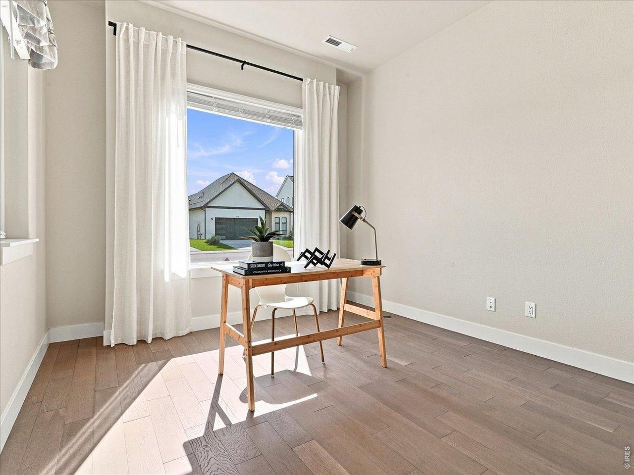 Property Photo 26 Flexible main-floor study easily doubles as another bedroom or guest suite.