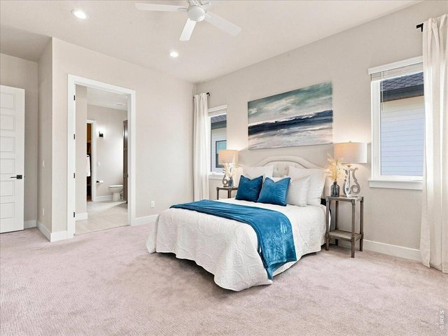 Property Photo 20 The spacious primary suite is conveniently located on the main level.