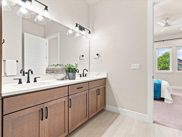 Property Photo 22 Dual vanities provide plenty of room for busy mornings.