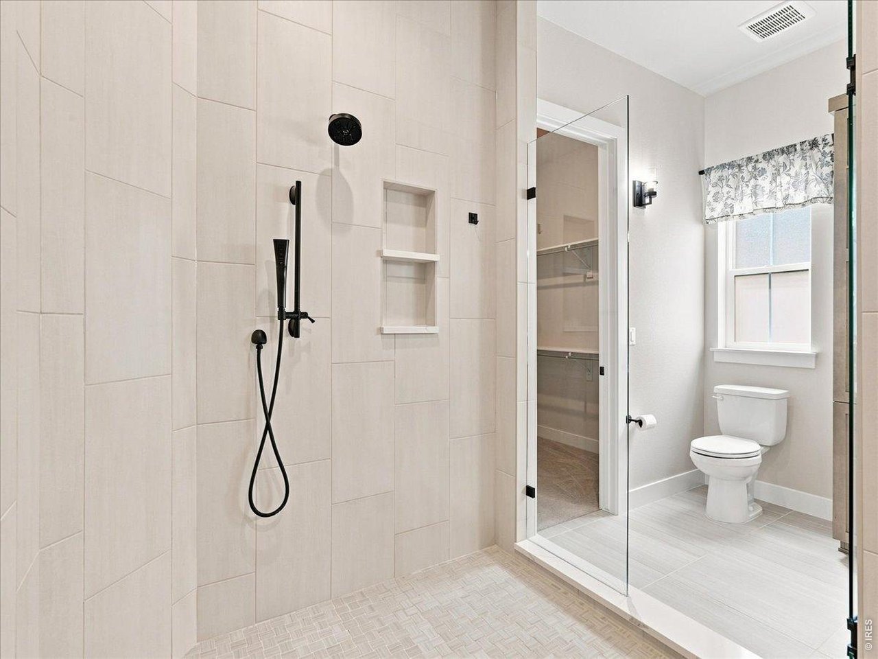 Property Photo 24 Spa-inspired primary bathroom offers everyday luxury.