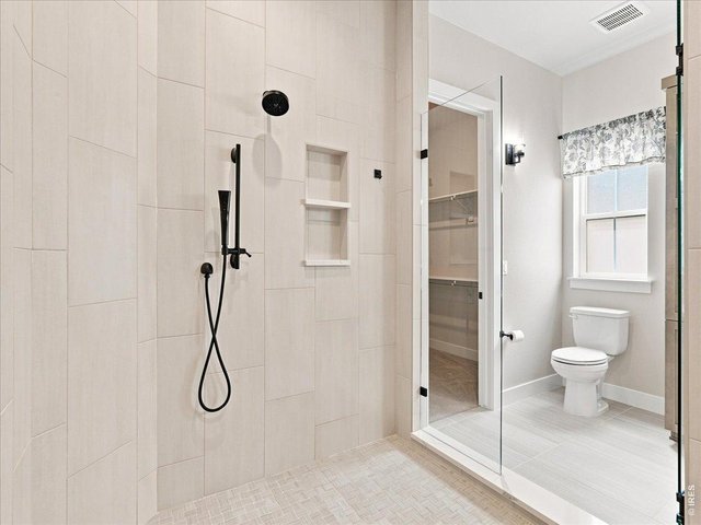 Property Photo 24 Spa-inspired primary bathroom offers everyday luxury.