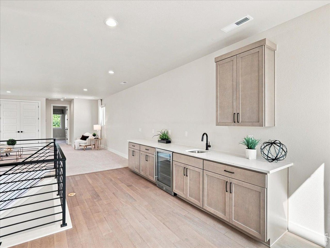 Property Photo 36 Wet bar with beverage refrigerator makes entertaining effortless.