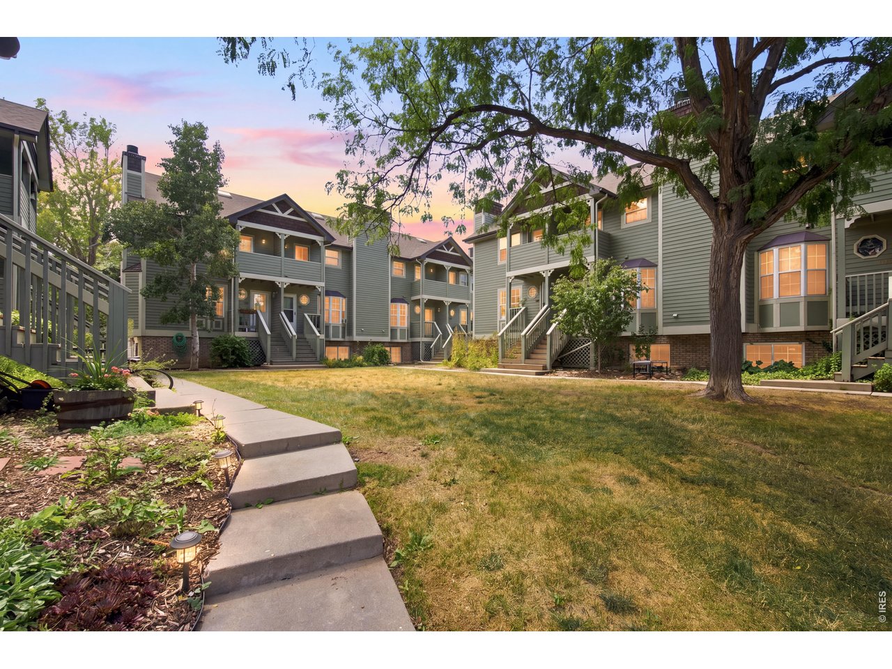Property Photo 31 Mature trees and established landscaping create an inviting neighborhood setting.