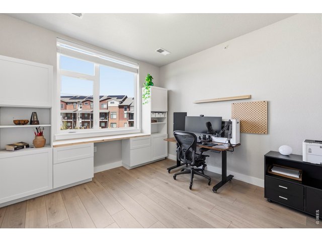 Property Photo 18 office comes complete with laminate plank Haven Toast to match the kitchen dining and living rooms