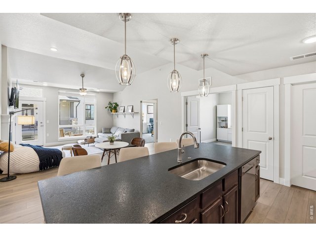 Property Photo 7 The kitchen as you walk in with Black pearled leather granite on the breakfast bar