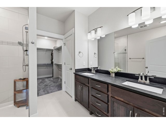 Property Photo 22 Undermount sinks, and black pearled leather counter double sink