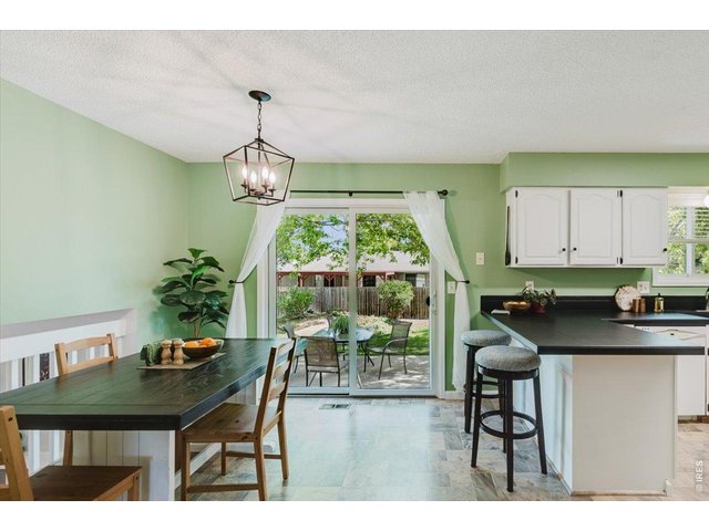 Property Photo 6 Dining area and kitchen are perfectly placed to take dinner outside