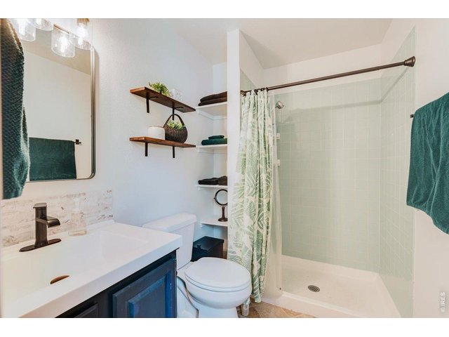 Property Photo 24 The primary bedroom has an updated en suite bathroom