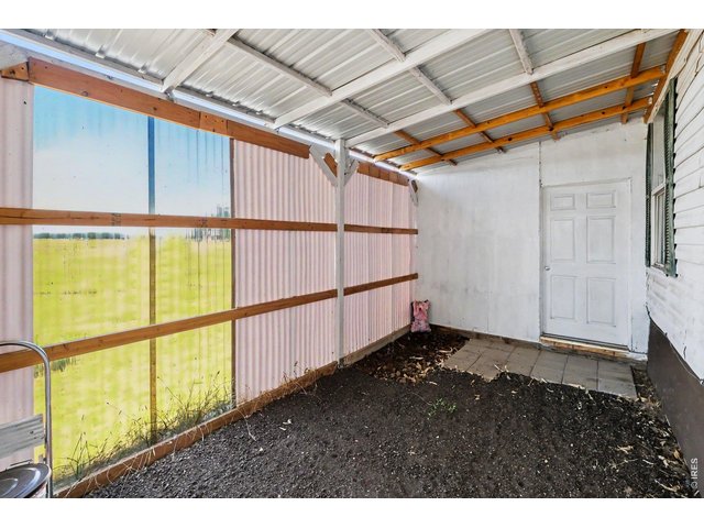 Property Photo 16 Two storage areas on side of house; one fully enclosed and locked, one three-fourths enclosed