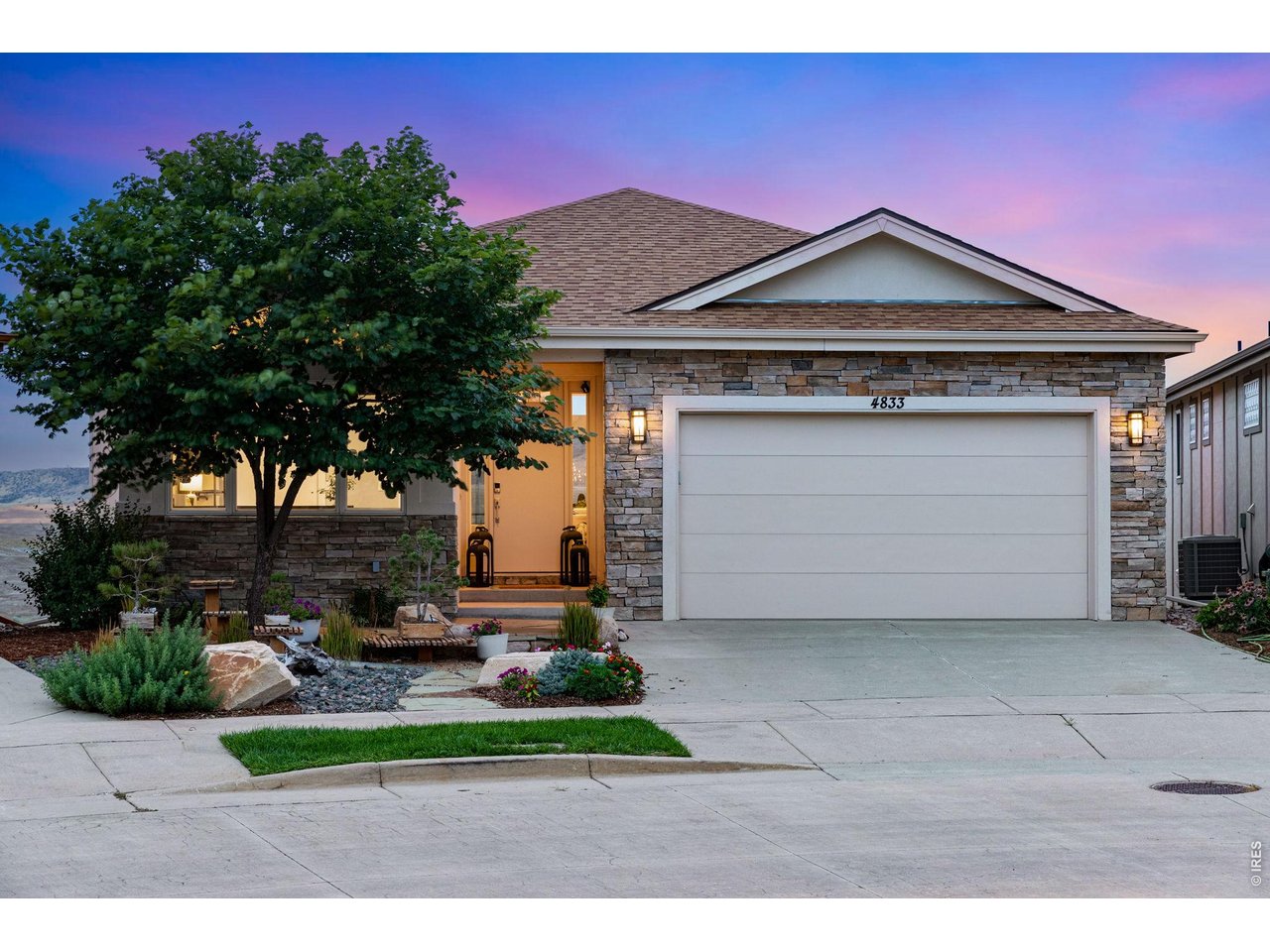 Property Photo 6 Welcome, beautiful flagstone entry and comfortable covered front porch and a beautiful RedBud tree to greet you!