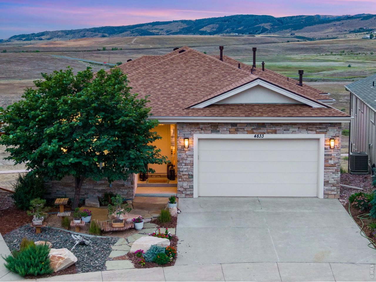 Property Photo 1 Exceptionally appointment Custom Ranch, Backing to approximately 240 acres of Open Space, Heavenly Mountain/Foothills views for as far as you can see! Curated Modern Feel, New Class IV roof installed 2026, low maintenance, stucco and stone exterior.