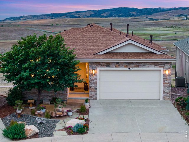 Property Photo 1 Exceptionally appointment Custom Ranch, Backing to approximately 240 acres of Open Space, Heavenly Mountain/Foothills views for as far as you can see! Curated Modern Feel, New Class IV roof installed 2026, low maintenance, stucco and stone exterior.