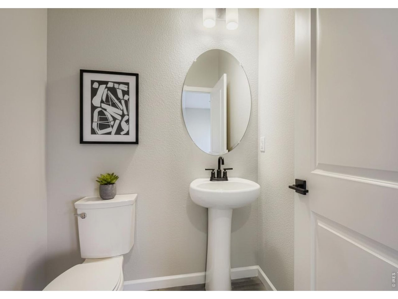 Property Photo 4 Powder Room (main level)