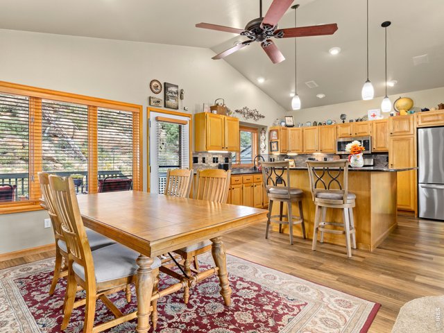Property Photo 17 Kitchen & dining areas with deck access