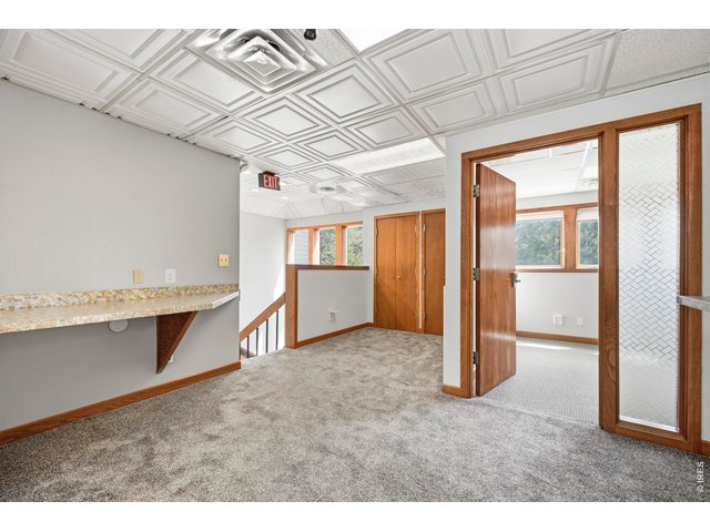 Property Photo 22 Upper level with private offices & more