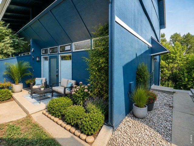 Property Photo 48 Private front patio, digitally enhanced
