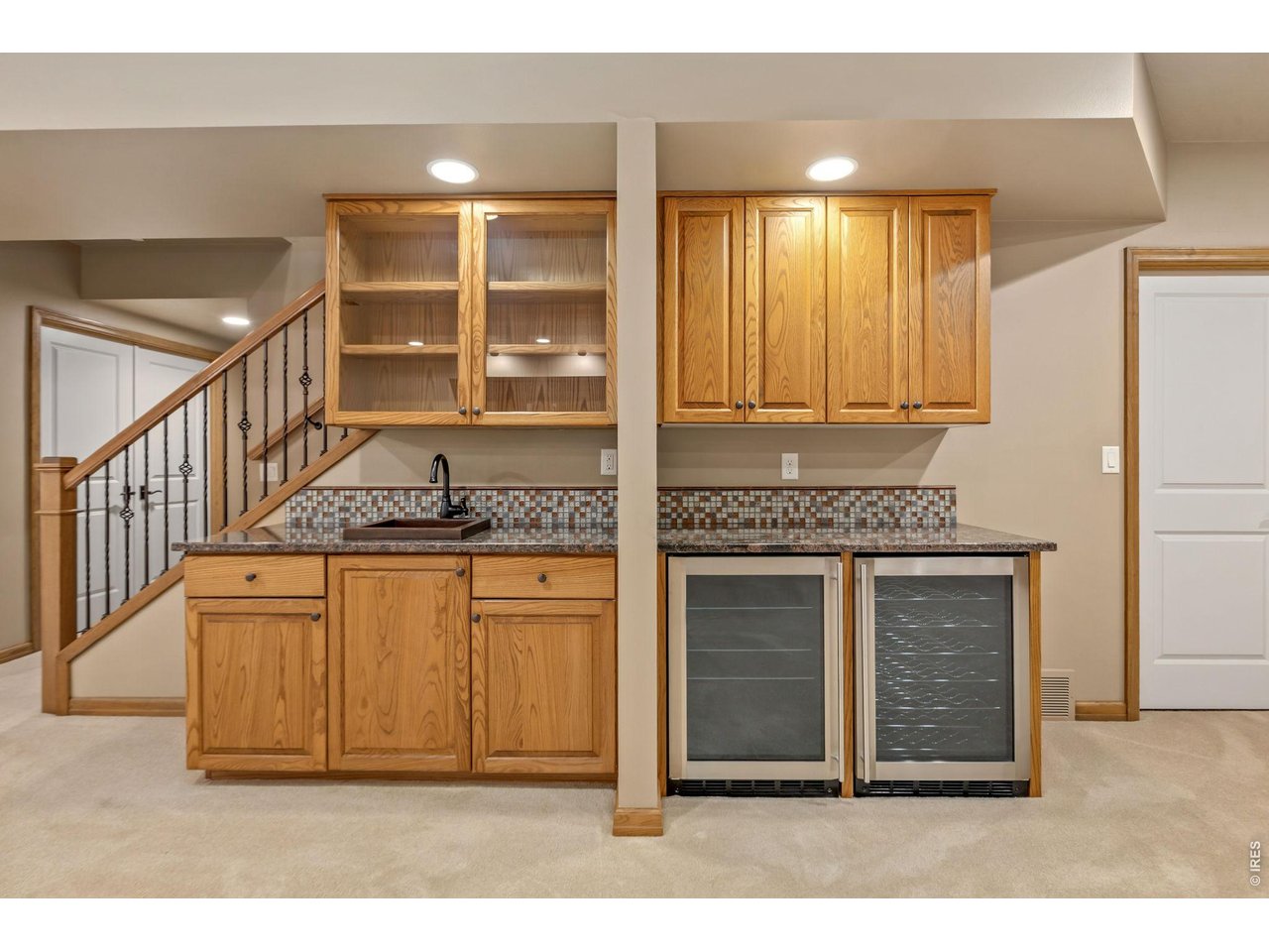Property Photo 32 Wetbar in Basement w/ (2) beverage refrigerators
