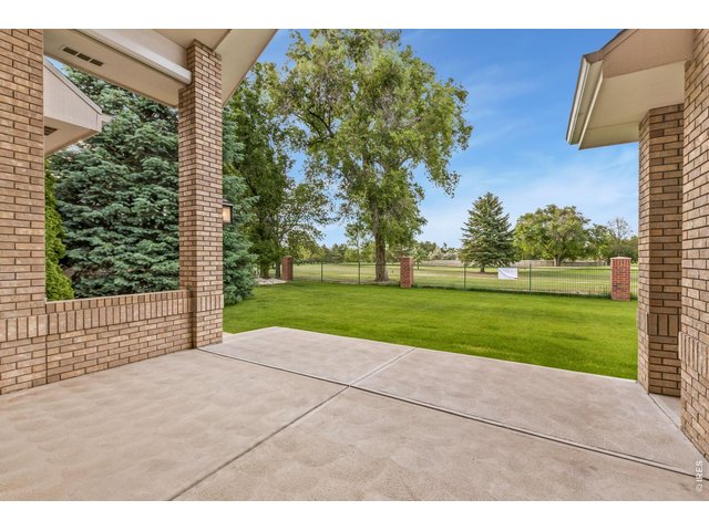 Property Photo 41 Covered rear patio backing to tee box for 5th hole