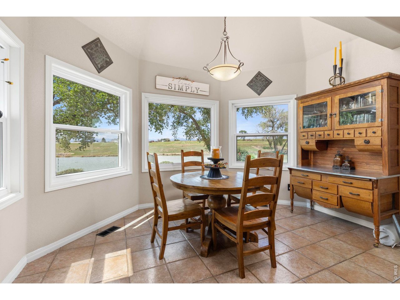 Property Photo 37 Breakfast area surrounded by windows overlooking the water and surrounding acreage.