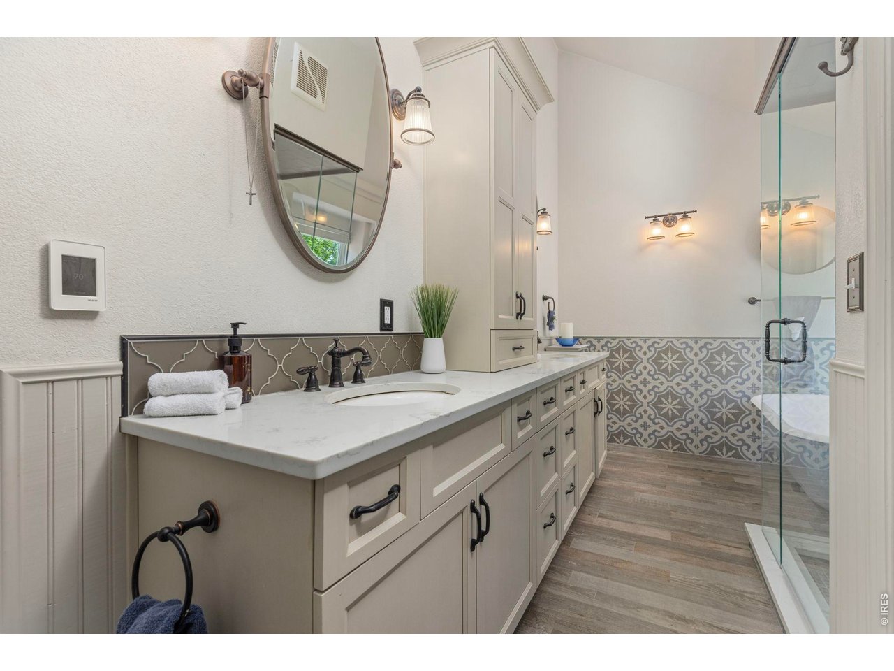 Property Photo 40 Updated primary bath with extensive cabinetry and walk-in shower.