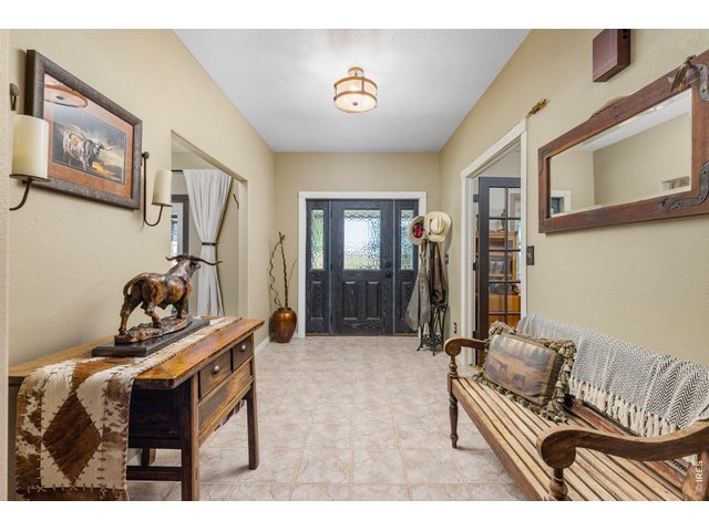 Property Photo 31 Spacious entry with warm Western character.