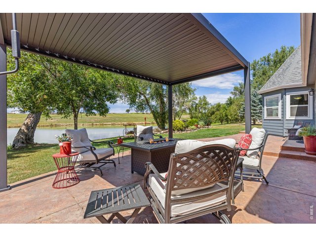 Property Photo 47 Covered patio overlooking Little Gem Reservoir an inviting place to relax and enjoy the water.