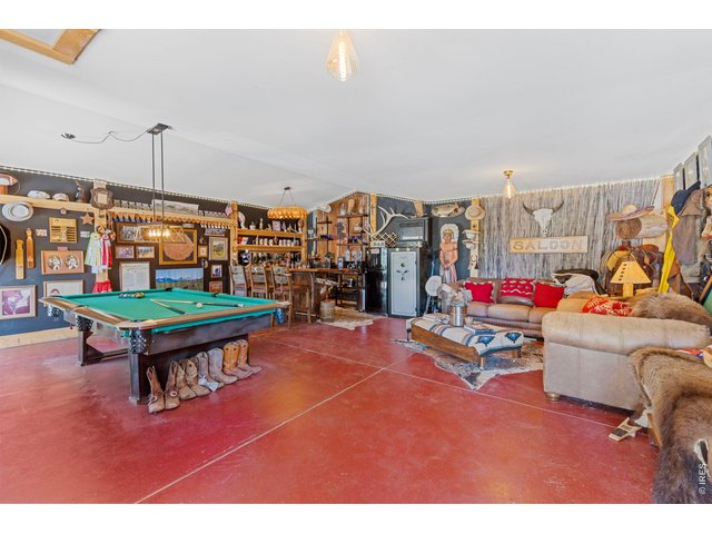 Property Photo 28 A one-of-a-kind recreation space with Western character ideal for gathering after a day of riding or fishing.