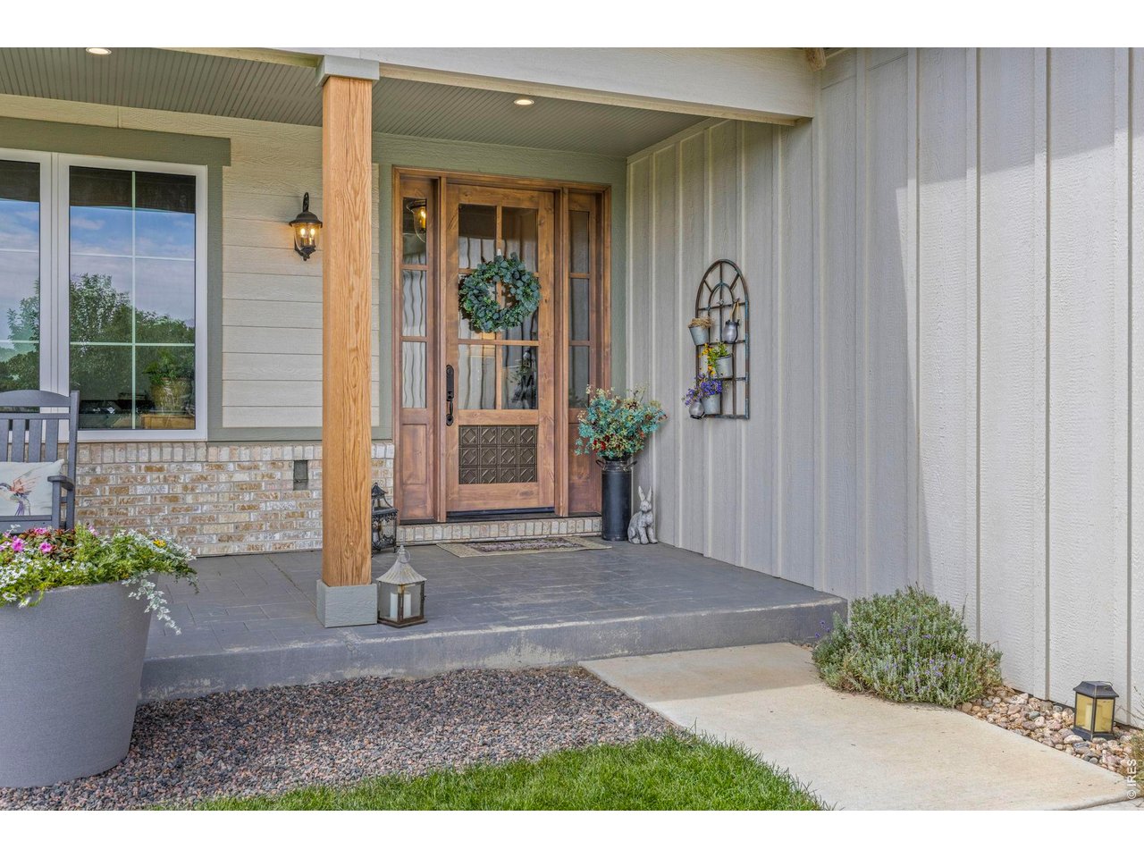 Property Photo 7 Welcoming covered entry to the newer residence.