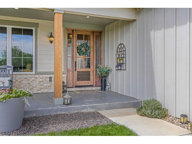 Property Photo 7 Welcoming covered entry to the newer residence.