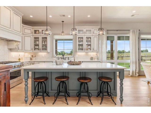 Property Photo 13 Generous kitchen island provides abundant workspace, seating and a natural gathering place.