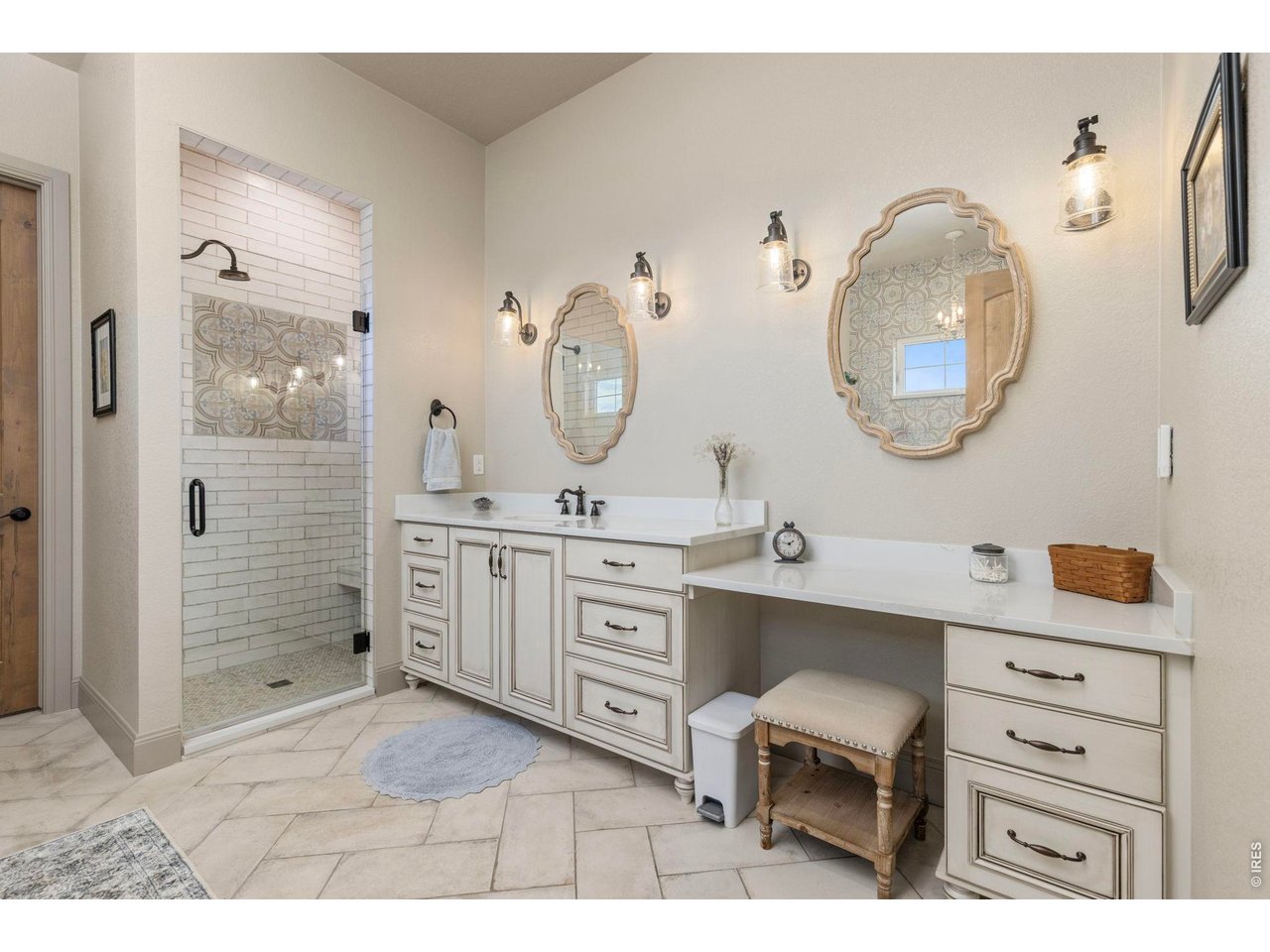 Property Photo 17 Primary bath with extensive cabinetry, dual vanities and a spacious walk-in shower.
