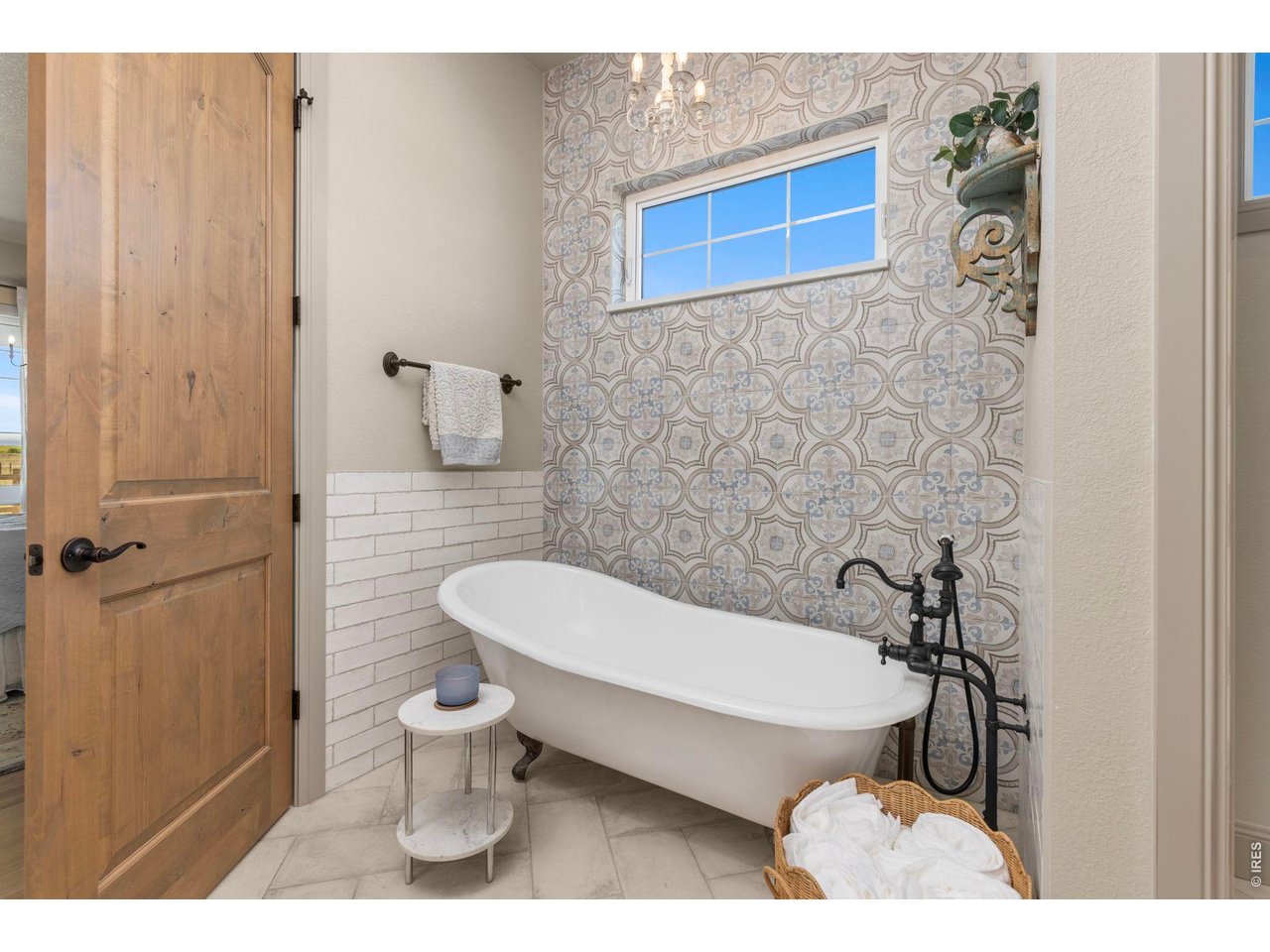 Property Photo 18 Freestanding soaking tub adds character to the beautifully finished primary bath.