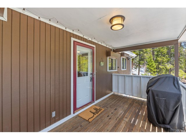 Property Photo 22 Covered Deck for Grilling just off of the Kitchen