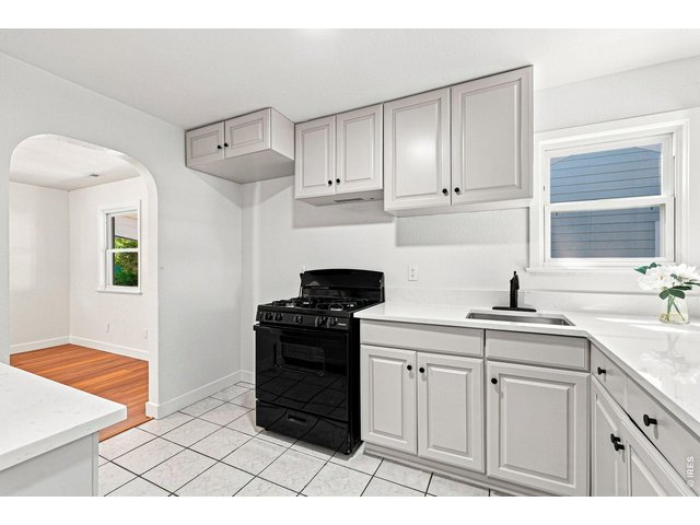 Property Photo 16 Brand-new kitchen with new cabinetry, quartz countertops, and a new gas range/oven