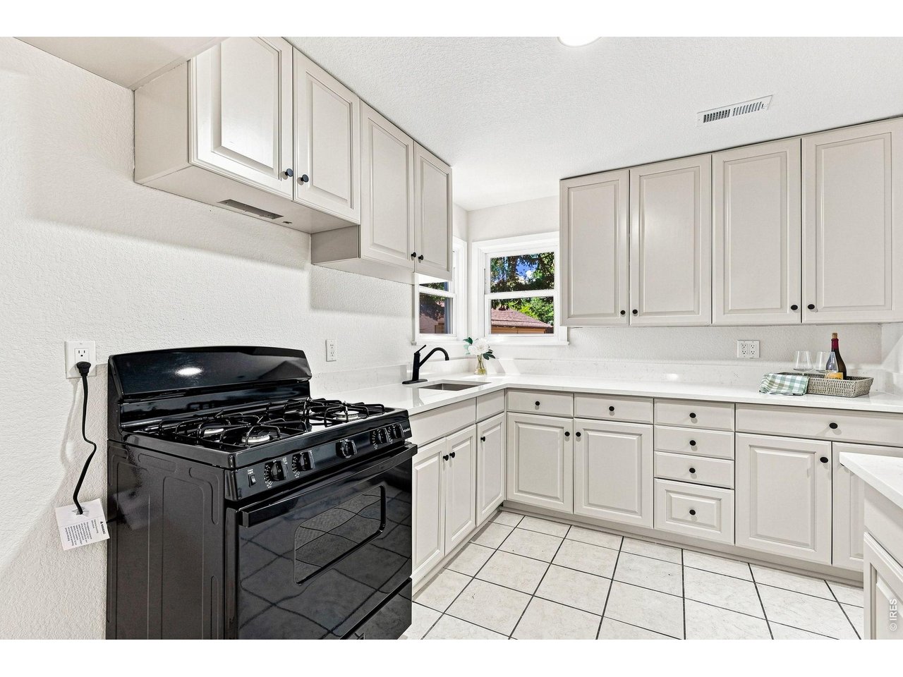 Property Photo 17 Brand-new kitchen with new cabinetry, quartz countertops, and a new gas range/oven