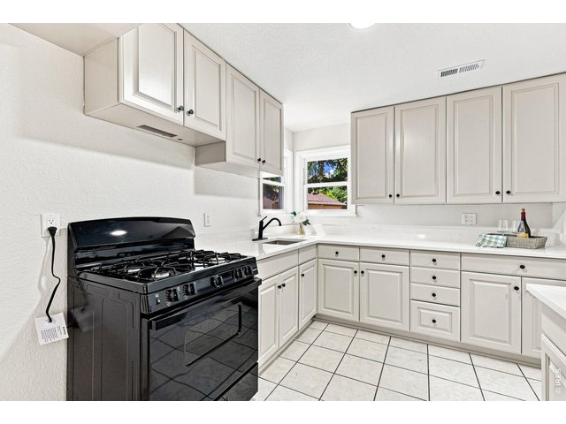 Property Photo 17 Brand-new kitchen with new cabinetry, quartz countertops, and a new gas range/oven