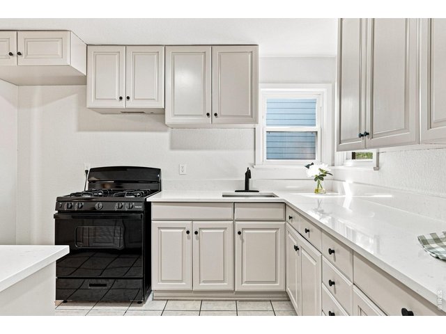 Property Photo 18 Brand-new kitchen with new cabinetry, quartz countertops, and a new gas range/oven