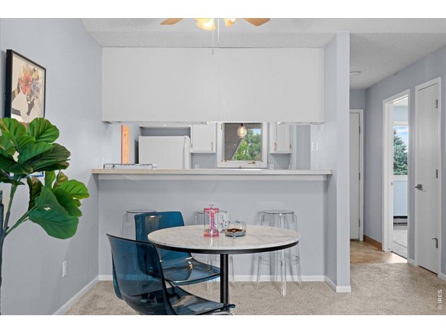 Property Photo 11 Dining space adjacent to kitchen bar and window