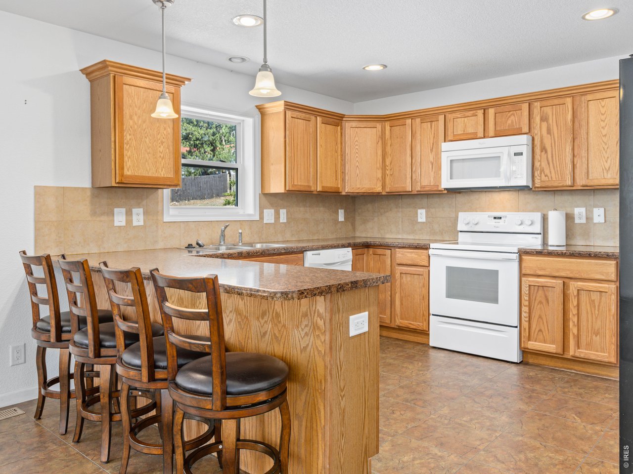 Property Photo 30 Full kitchen with breakfast bar.