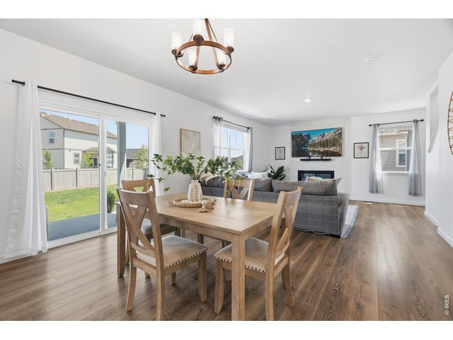 Property Photo 5 Light, airy kitchen opens to the dining nook with plenty of storage and counter space.