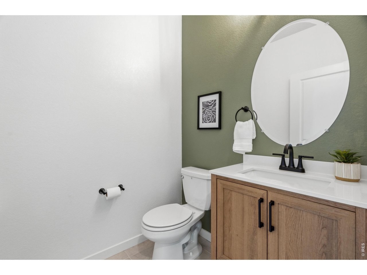 Property Photo 15 Stylish and convenient main-floor powder room.