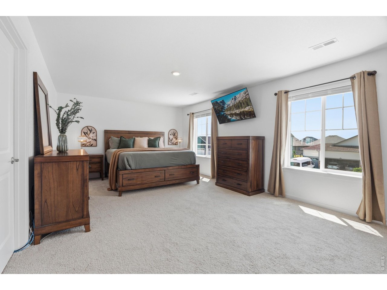 Property Photo 16 Expansive primary suite easily fits a king set with room to spare.
